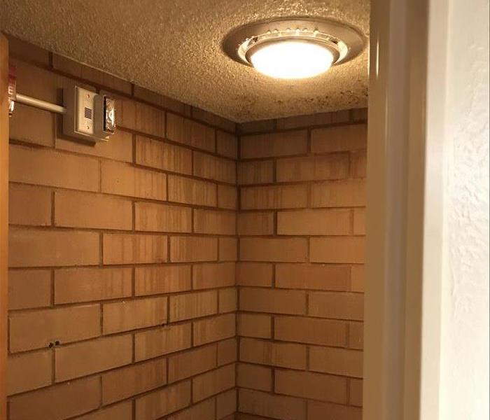 Water coming through ceiling a bathroom