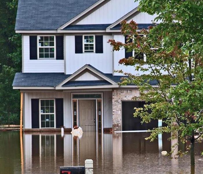 A home that is surrounded by flood waters
